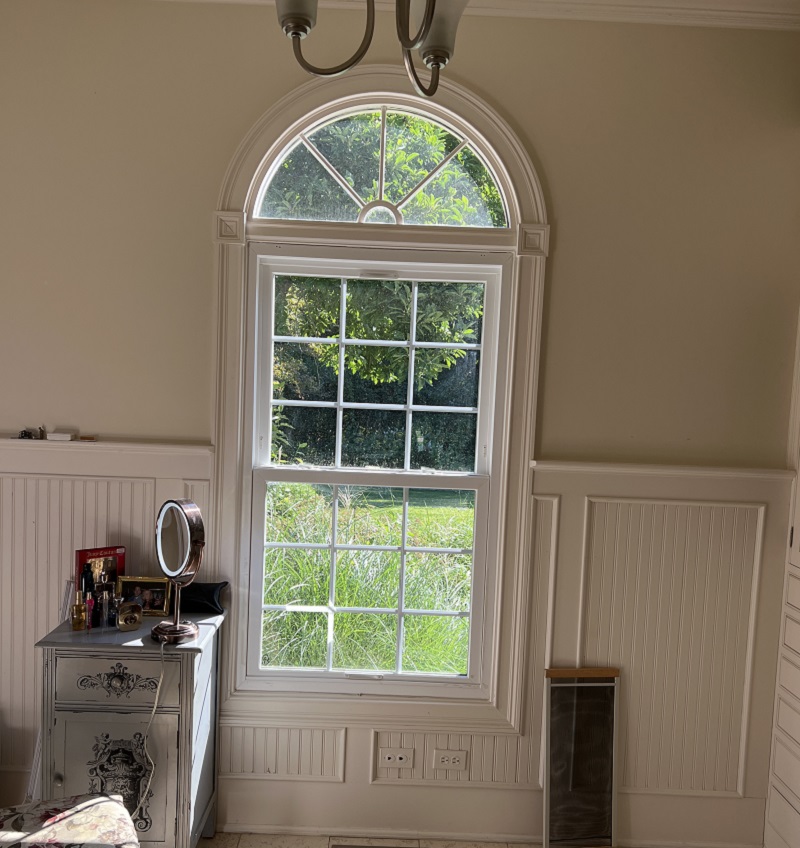 Old vinyl round top window
